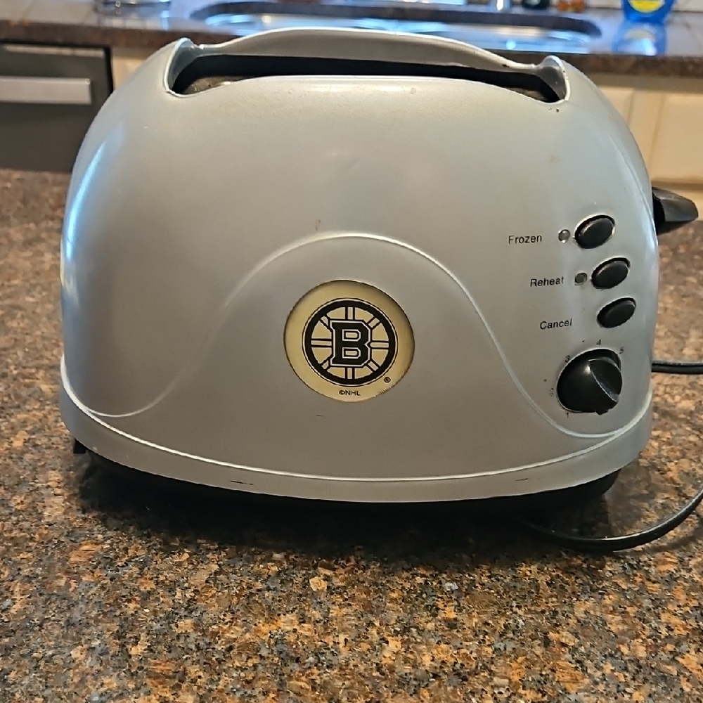 Silver Toaster with Control Buttons